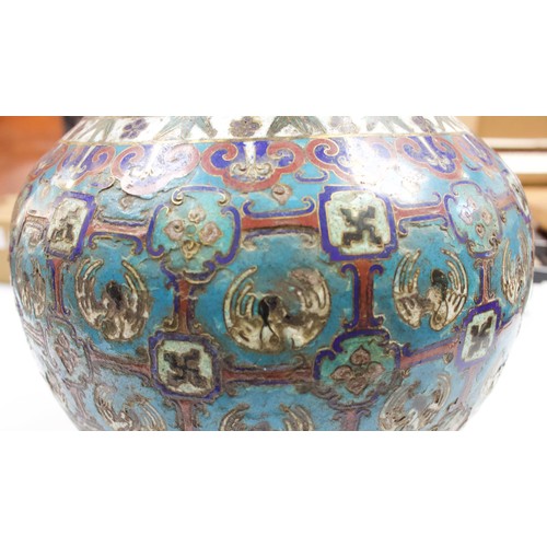 63 - An early 20th century Chinese cloisonne enamel vase, of baluster form with gilt-brass elephant handl... 