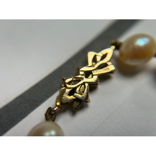 158 - Two strings of cultured pearls, one shorter string with 9ct gold clasp, together with one longer con... 