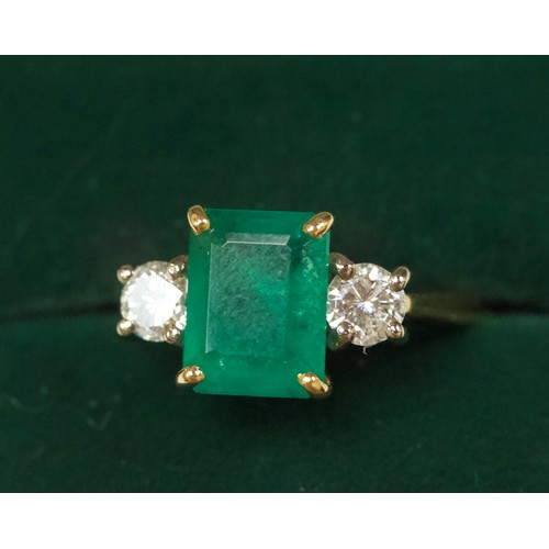 167 - An 18ct gold dress ring, four-claw set with a rectangular-shaped emerald, measuring approximately 10... 