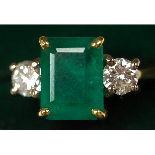 167 - An 18ct gold dress ring, four-claw set with a rectangular-shaped emerald, measuring approximately 10... 