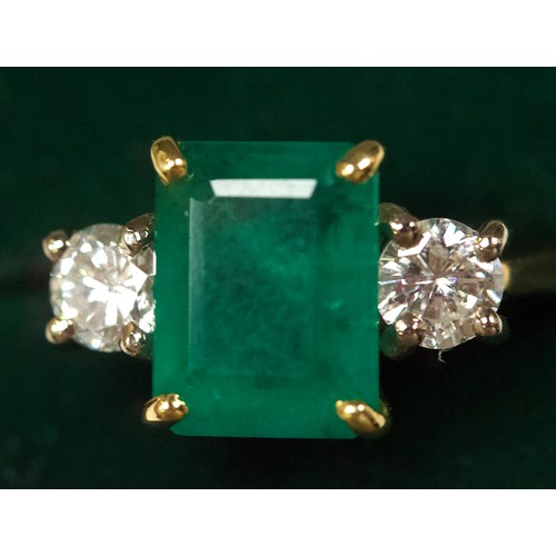 167 - An 18ct gold dress ring, four-claw set with a rectangular-shaped emerald, measuring approximately 10... 