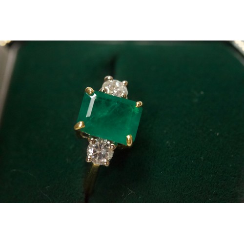 167 - An 18ct gold dress ring, four-claw set with a rectangular-shaped emerald, measuring approximately 10... 