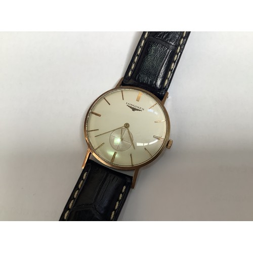 120 - A vintage 9ct gold cased gents Longines wristwatch, C.1950’s, the silvered dial with gilt batons den... 