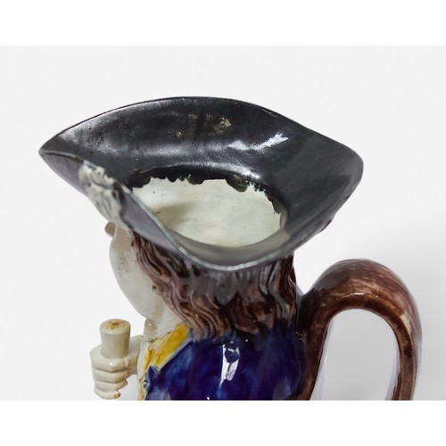 32 - A Prattware ‘Sailor’ toby jug, c1790-1810, black tricorn hat, blue striped britches, overflowing bro... 