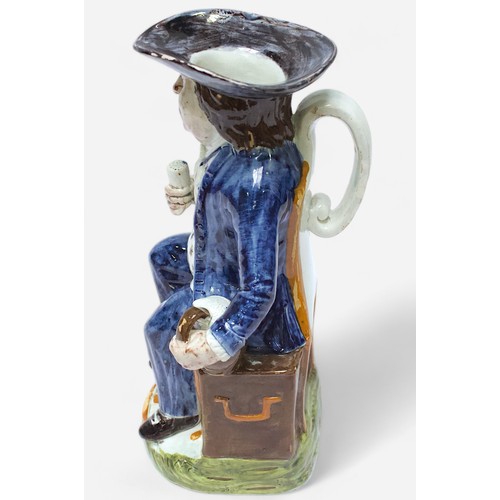 34 - A Prattware ‘Sailor’ toby jug, c1790-1810, blue frockcoat and britches, waistcoat painted with stars... 