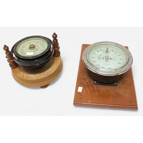 20 - A Japanese gimbal compass by Tokyo Keiki Co. Ltd, in black metal case with engraved plaque, raised o... 