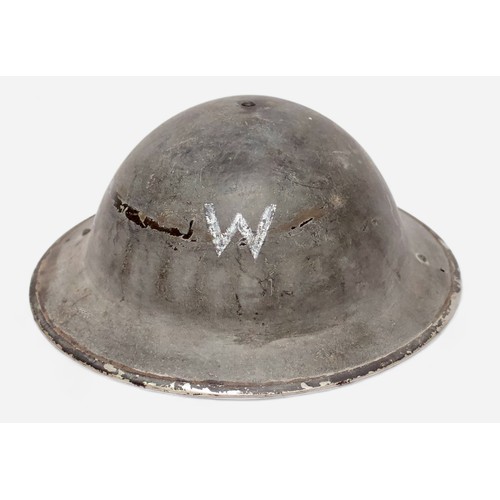 52 - A British WWII Air Raid Wardens Brodie helmet, with leather liner and khaki webbing chin strap, toge... 