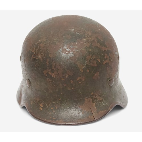 50 - An original WWII German Third Reich M35 Stahlhelm steel combat helmet, with double decal, Eagle Swat... 