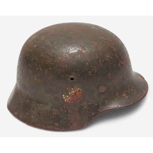 50 - An original WWII German Third Reich M35 Stahlhelm steel combat helmet, with double decal, Eagle Swat... 