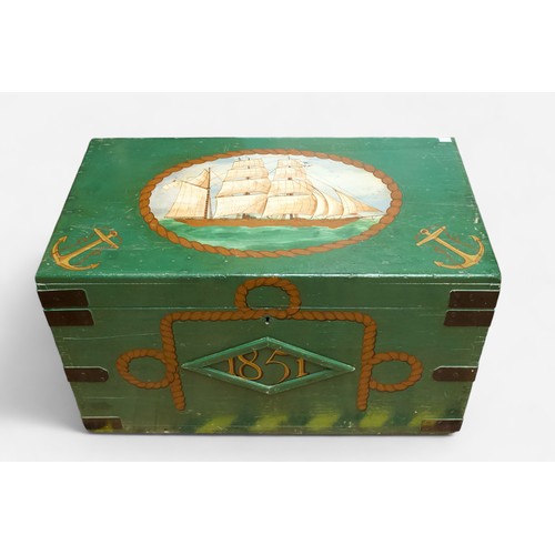 29 - A large metal-bound wooden sea chest, later painted green and with nautical decoration to the top an... 