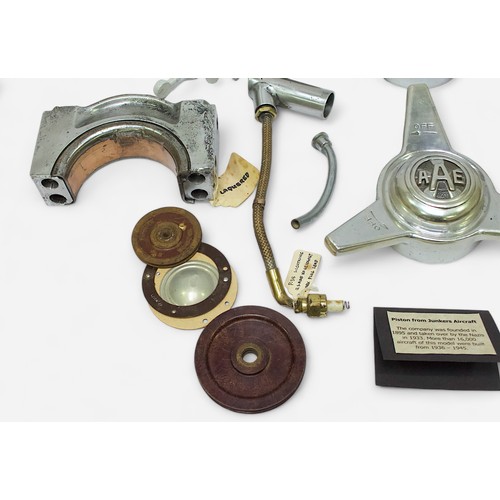 91 - A collection WWII parts, an engine piston removed from a Junkers aircraft, main bearing cap from Jun... 