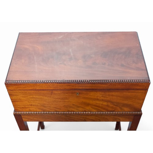 18 - A mahogany campaign style writing slope on stand, of rectangular form and gadrooned detail to top ed... 