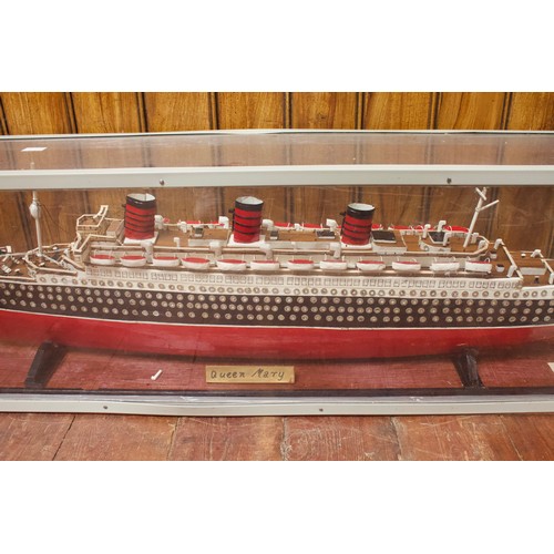 99 - A large scratch built model of the White Star Line RMS Queen Mary, with wood effect deck, lifeboats ... 