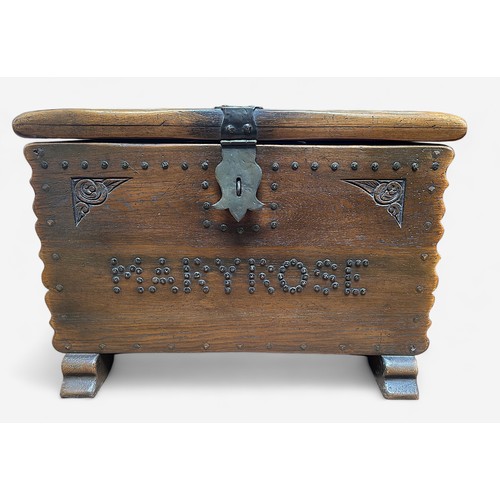 4 - A replica oak 'treasure-chest' or coffer, with iron hasp and staple, hinges and lock, studded decora... 