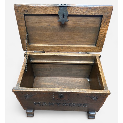 4 - A replica oak 'treasure-chest' or coffer, with iron hasp and staple, hinges and lock, studded decora... 