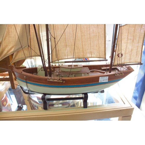 184 - A large vintage 'Gaff-Rigged' pond yacht, with cotton sails, lined deck, cream waterline-painted woo... 