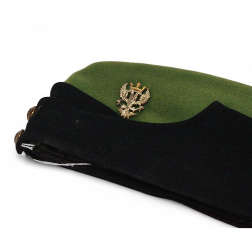 261 - A Royal Marines peaked dress cap with cap badge, a green and black side cap with Mercian regiment ca... 