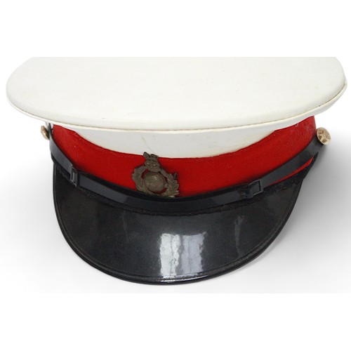 261 - A Royal Marines peaked dress cap with cap badge, a green and black side cap with Mercian regiment ca... 