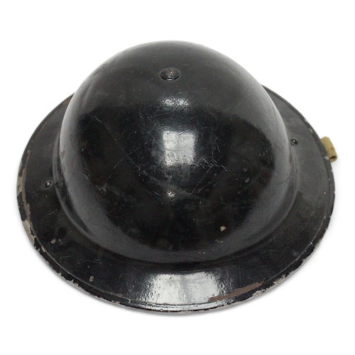 286 - A black painted British WWII fire brigade steel helmet, with decal to front, numbered 431194 to insi... 