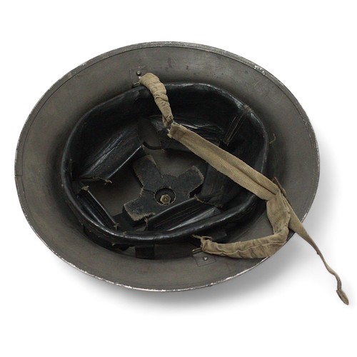 286 - A black painted British WWII fire brigade steel helmet, with decal to front, numbered 431194 to insi... 