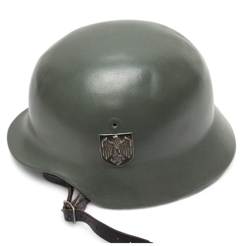 275 - A WWII German Third Reich M40 helmet, with nine-tongue leather liner, repainted green and later appl... 