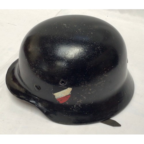 277 - A WWII German Third Reich M40 helmet, numbered ET66 5070, with eight-tongue leather liner, black pai... 