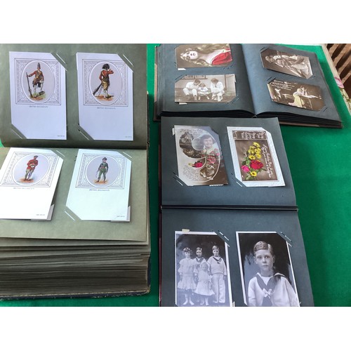 427 - Four albums of standard-size postcards, two smaller albums and some loose cards. The main/bigger alb... 