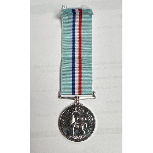 354 - The Rhodesia Medal 1980 to '24442182 Sig S.J. Townsend. R. Signals,' together with The Zimbabwe Inde... 