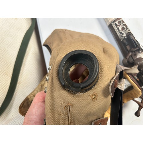 76 - An RAF D-Type Pilot’s Flight helmet with goggles, khaki canvas with neck flap, fitted with a set Gos... 