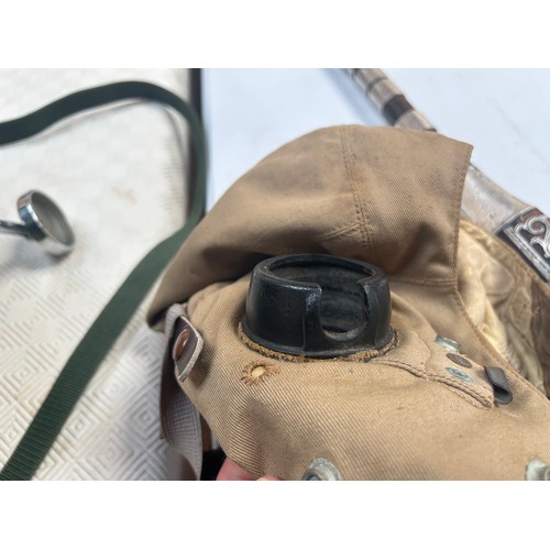 76 - An RAF D-Type Pilot’s Flight helmet with goggles, khaki canvas with neck flap, fitted with a set Gos... 