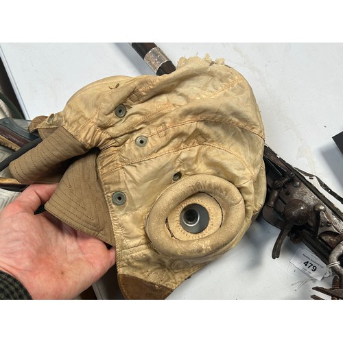 76 - An RAF D-Type Pilot’s Flight helmet with goggles, khaki canvas with neck flap, fitted with a set Gos... 