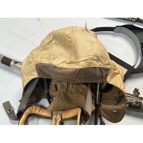 76 - An RAF D-Type Pilot’s Flight helmet with goggles, khaki canvas with neck flap, fitted with a set Gos... 