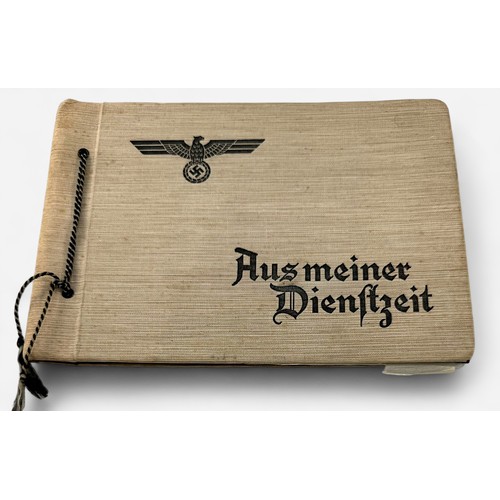 585 - A WWII German Third Reich photogrpah album, the front cover embossed with the Reichsadler and the wo... 