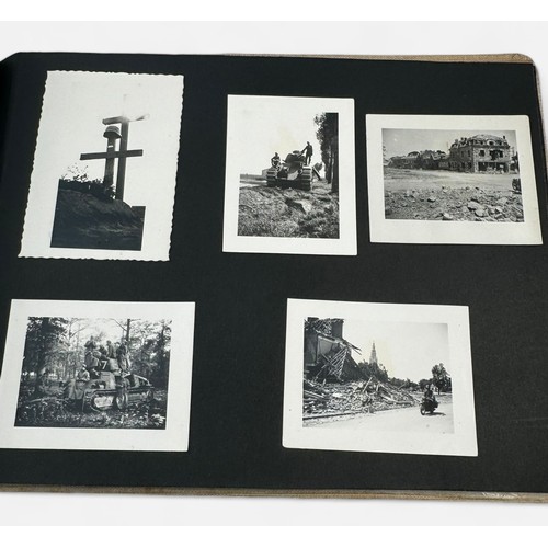 585 - A WWII German Third Reich photogrpah album, the front cover embossed with the Reichsadler and the wo... 