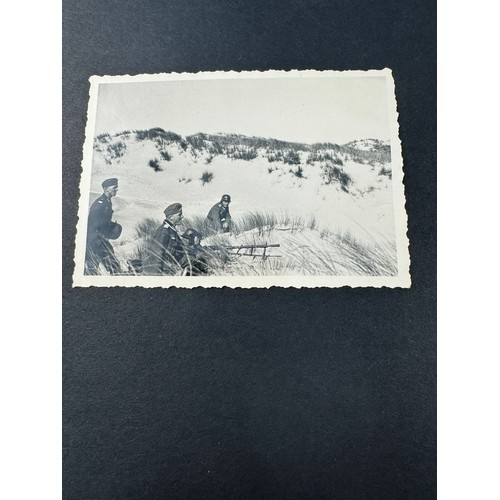 585 - A WWII German Third Reich photogrpah album, the front cover embossed with the Reichsadler and the wo... 