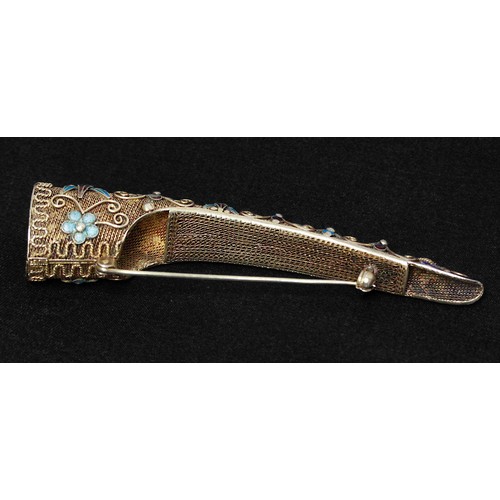 69D - A Chinese silver-gilt filigree finger nail guard brooch, with enamelled foliate decoration and set w... 