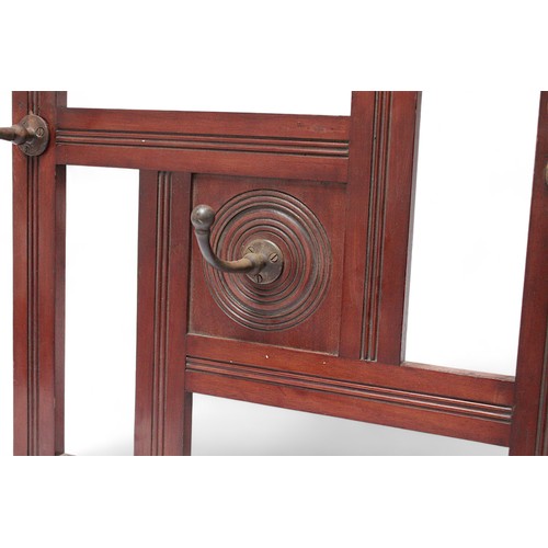 123D - A late 19th Century Victorian mahogany wall-mounted coat rack in the manner of James Shoolbred, with... 