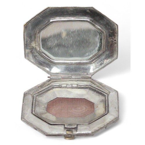 186D - A 20th Century Indonesian white-metal and enamelled compact, of octagonal form, depicting a lion bit... 