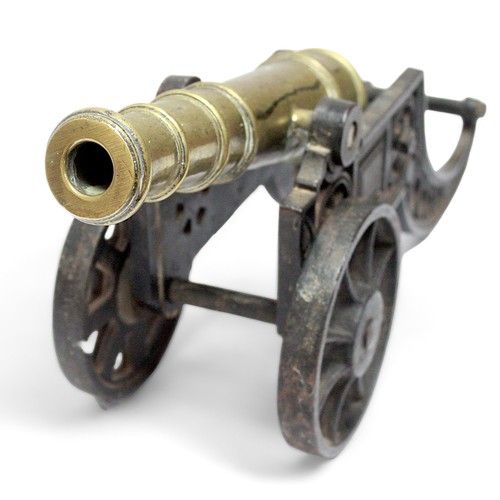 589 - A brass cannon on bronzed carriage, 43cm long overall