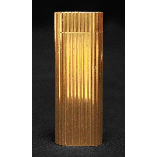 463 - A gold-plated Must de Cartier lighter, of rectangular form with rounded ends and reeded pattern to s... 