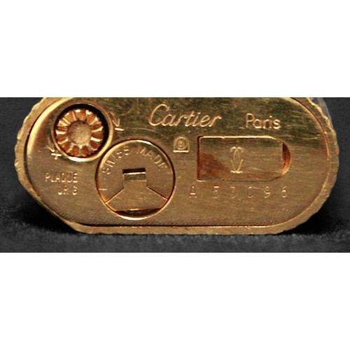 464 - A gold-plated Must de Cartier lighter, of rectangular form with rounded ends and reeded pattern to s... 