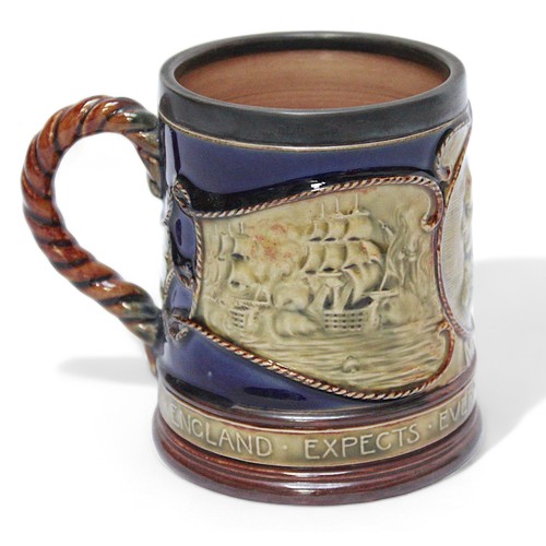 38 - A Royal Doulton Stoneware pottery mug, ‘Nelson, England expects everyman will do his duty’, with sil... 