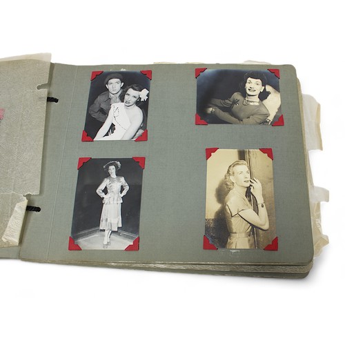 466 - A photo album containing over 100 monochrome photographs of mid 20th Century 'drag queens' in costum... 