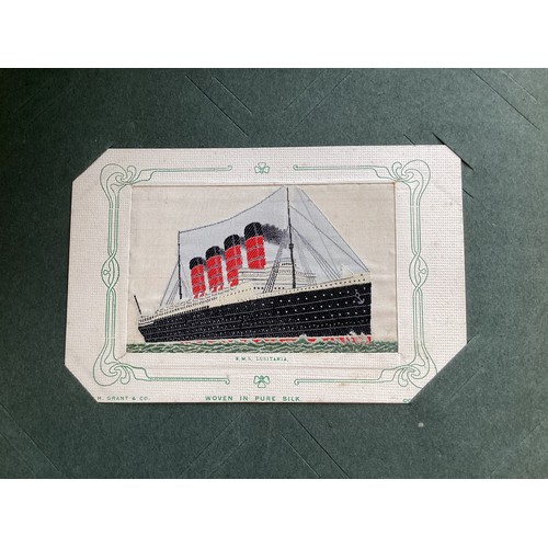 394 - An album containing approximately 290 standard-size postcards, which include 3 woven silk cards (two... 