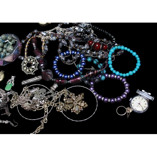 242 - A good collection of assorted costume jewellery including chains, rings, some silver examples, micro... 