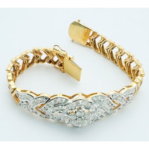 257 - An 18ct yellow gold bracelet, set with 91 x round brilliant cut diamonds, with a claw-set daisy clus... 