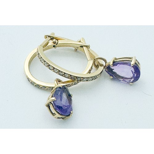 261 - A pair of 18ct yellow gold diamond set earrings, each set with a pear shaped amethyst drop, total di... 