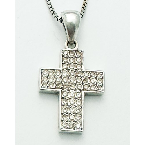 265 - An 18ct white gold cross and chain, the cross pave set with small round diamonds, total diamond weig... 