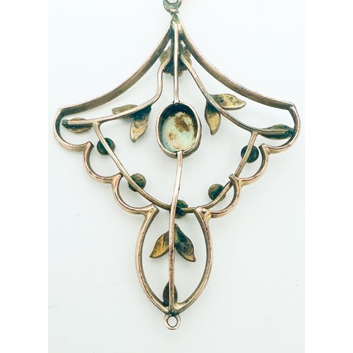 276 - A yellow metal Edwardian style pendant, bezel set with an oval shaped opal to the centre, with vario... 