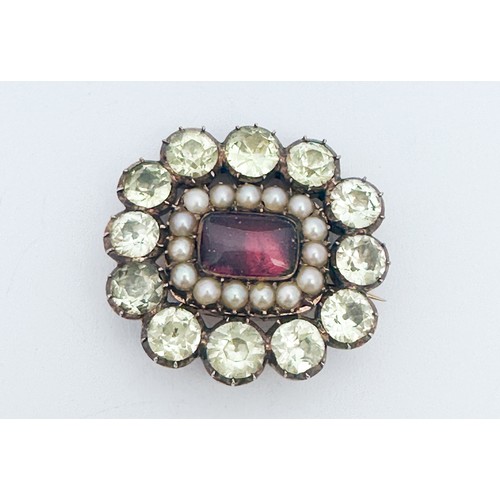 298 - An unmarked metal Georgian mourning brooch, set with 12 x faceted pale green gemstones, and 16 x sma... 